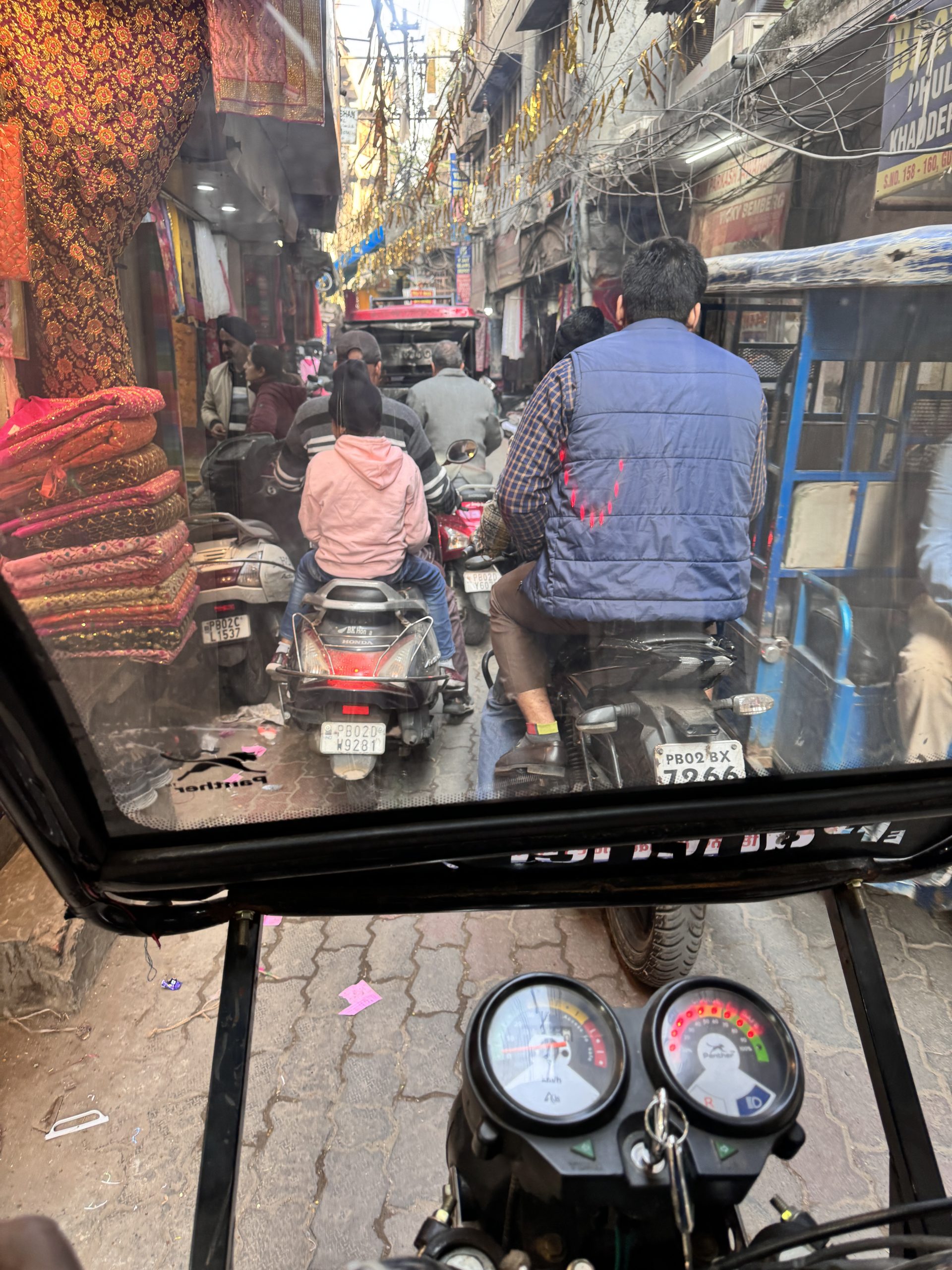 Amritsar old city shopping street viewed from a rickshaw
