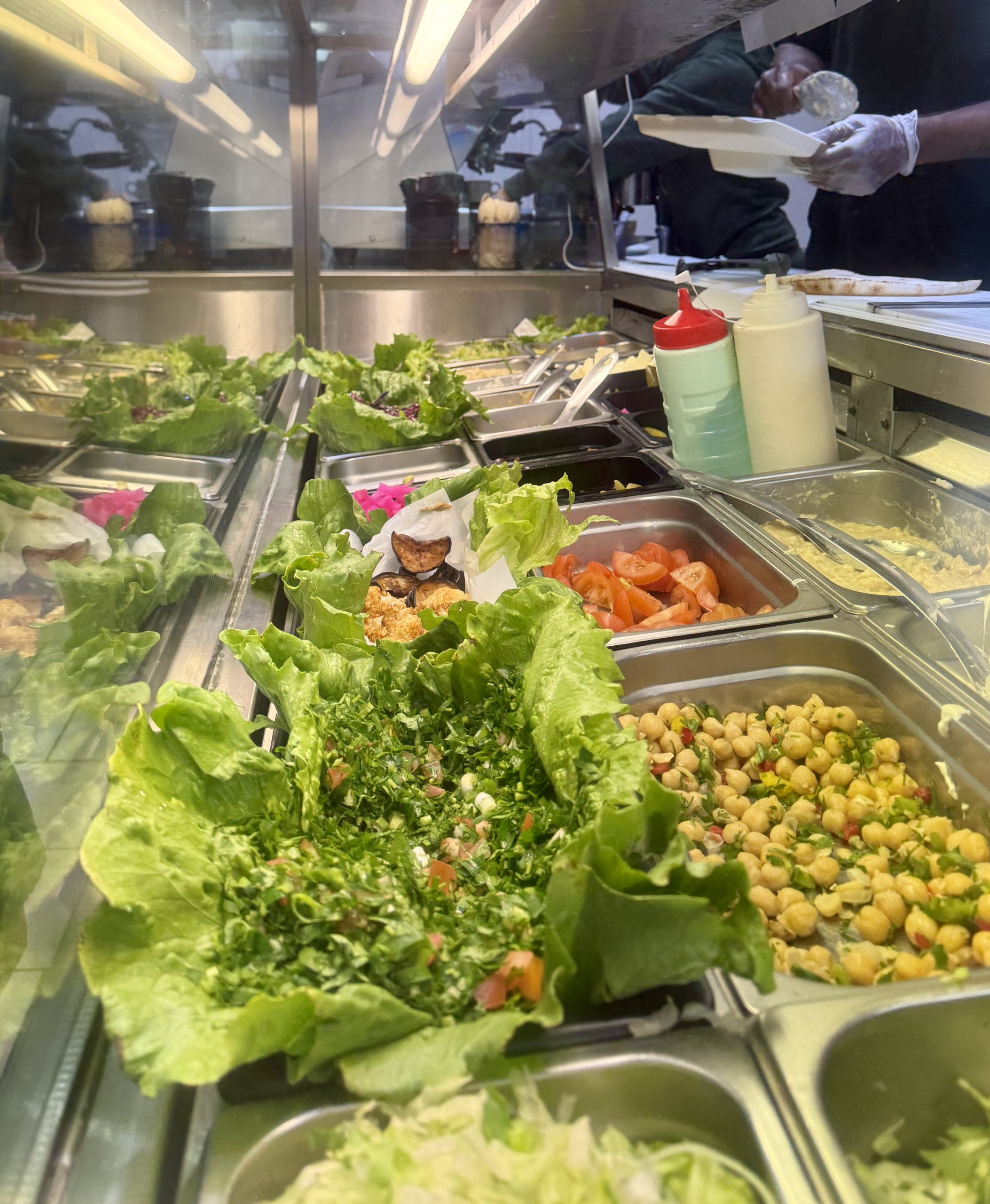 Fresh salad, herbs, chickpeas and pickles at Half Moon Cafe Coburg counter